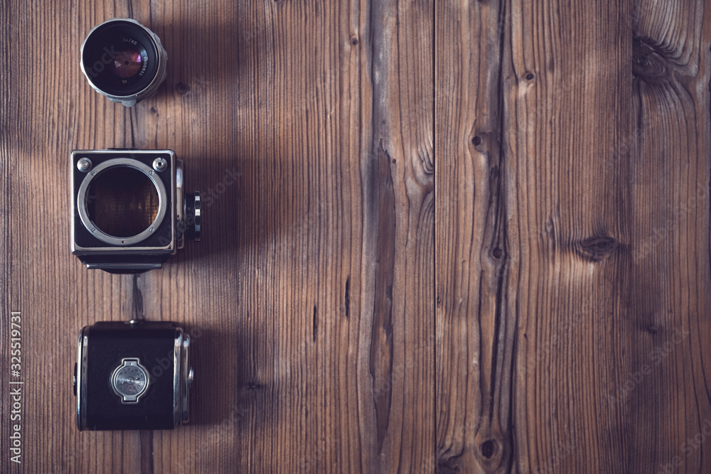 vintage camera on a wood background..