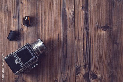 vintage camera on a wood background..