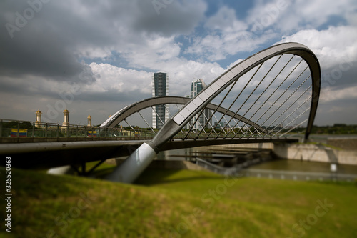 Putrajaya bridge in the artificially grown city of Putrajaya, Selangor, Malaysia. Since the traffic in Kuala Lumpur got more, the Malaysian government decided 1995 to build a new seat outside  photo