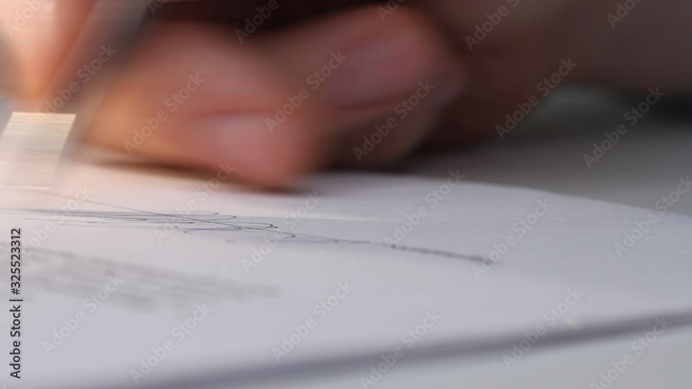 Closeup shot of a business man signing a contract, legal agreement or paper. Man is approve documents by signing papers.