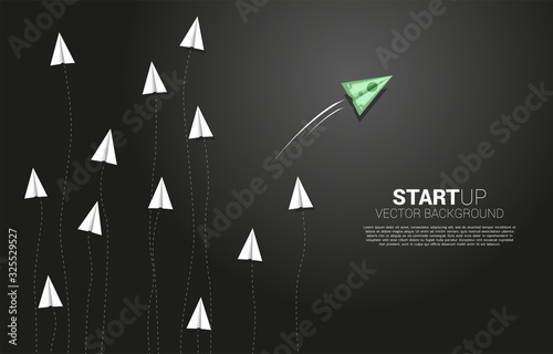 money banknote origami paper airplane going out from group of white. Business Concept of disruption and vision mission.