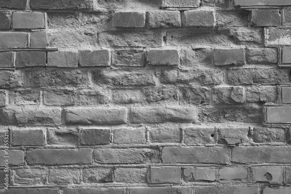 Weathered stained old brick wall background Weathered stained old brick wall background