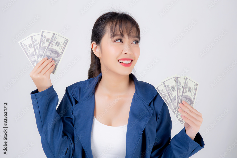 Beautiful portrait young business asian woman holding money isolated on white background, businesswoman showing banknotes with excited, happy girl income with profit finance and success concept. Beautiful portrait young business asian woman holding money isolated on white background, businesswoman showing banknotes with excited, happy girl income with profit finance and success concept.