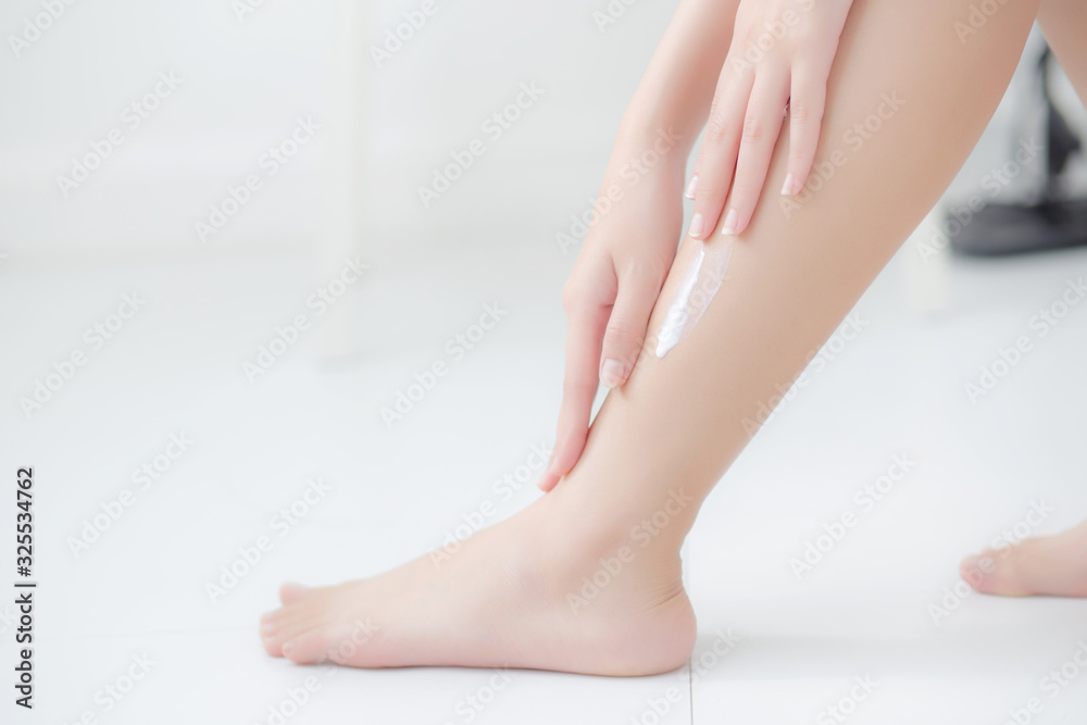 Beautiful asian woman touch skin leg smooth with cream and lotion for hydration and smooth, girl applying body care and cosmetic for silky and soft, beauty perfect with wellness, health and care. Beautiful asian woman touch skin leg smooth with cream and lotion for hydration and smooth, girl applying body care and cosmetic for silky and soft, beauty perfect with wellness, health and care.