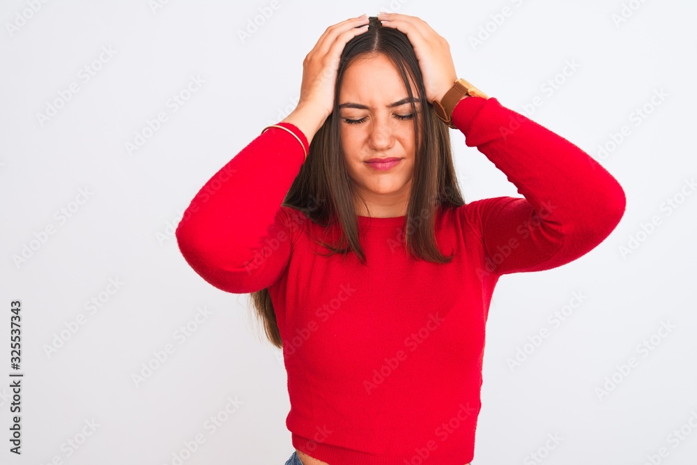 Young beautiful girl wearing red casual t-shirt standing over isolated white background suffering from headache desperate and stressed because pain and migraine. Hands on head. Young beautiful girl wearing red casual t-shirt standing over isolated white background suffering from headache desperate and stressed because pain and migraine. Hands on head.