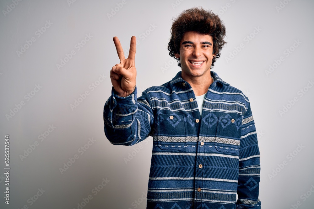 Young handsome man wearing casual shirt standing over isolated white background showing and pointing up with fingers number two while smiling confident and happy. Young handsome man wearing casual shirt standing over isolated white background showing and pointing up with fingers number two while smiling confident and happy.
