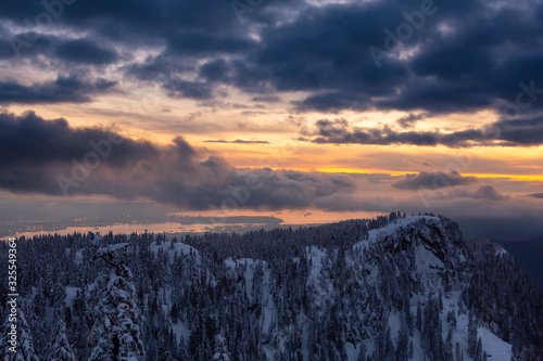 Canadian Nature Landscape covered in fresh white Snow during colorful and vibrant winter sunset. Taken in Seymour Mountain, North Vancouver, British Columbia, Canada. Panorama