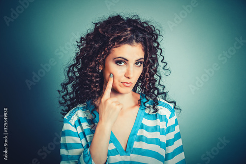 Have shame. Serious woman teacher showing have conscience hand gesture photo