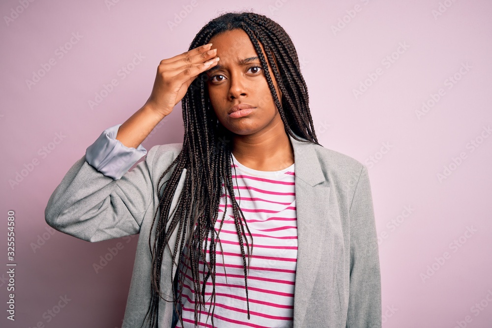 Young african american business woman standing over pink isolated background worried and stressed about a problem with hand on forehead, nervous and anxious for crisis Young african american business woman standing over pink isolated background worried and stressed about a problem with hand on forehead, nervous and anxious for crisis