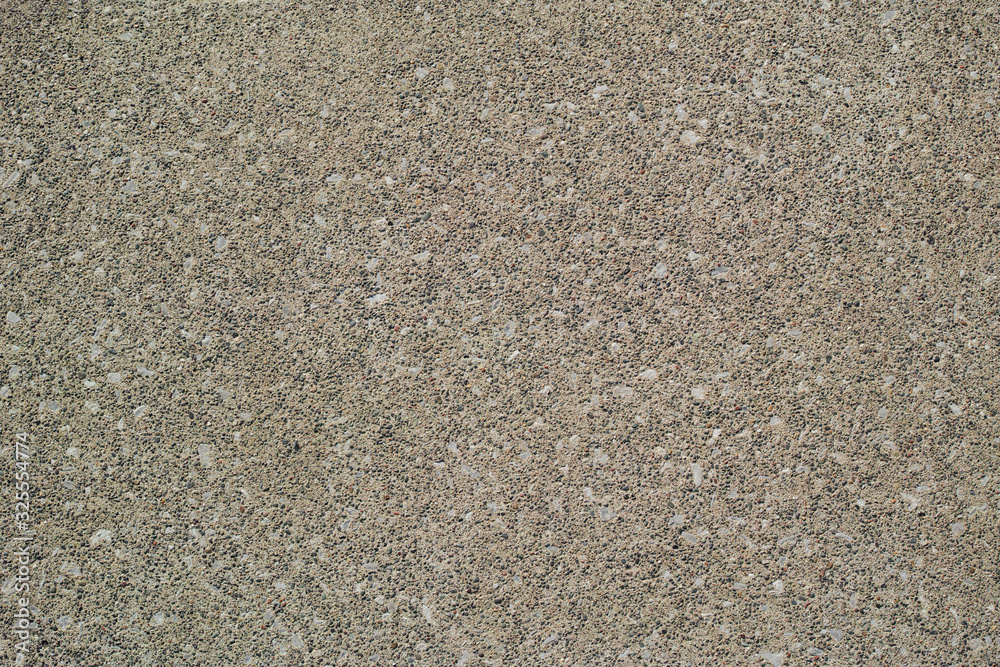 砂色でザラザラした細かい砂利が浮き出たコンクリート舗装の表面 Stock Photo Adobe Stock