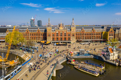 Photography Aerial view of the central train station in Amsterdam which is the oldest station in the Netherlands