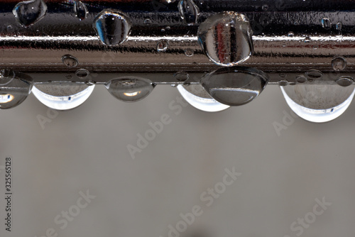Hanging droplets around metal handrail