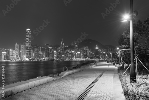 Photography Seaside promenade and skyline of Hong Kong city at night