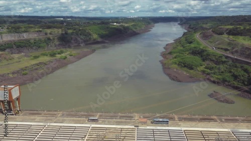 Tourism bus crossing the road above the Parana River. Itaipu dam 