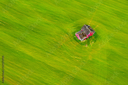 Red House Alone in a Field photo