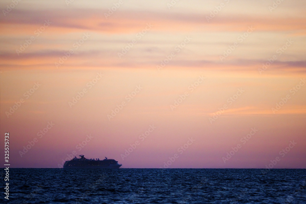 Cruise ship crossing the Gulf of Mexico at sunset.