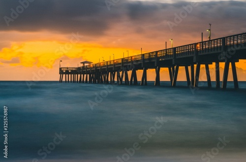 sunset sun sea bridge water beach orange sky landscape florida sunrise ocean coast calm beautiful blue yellow