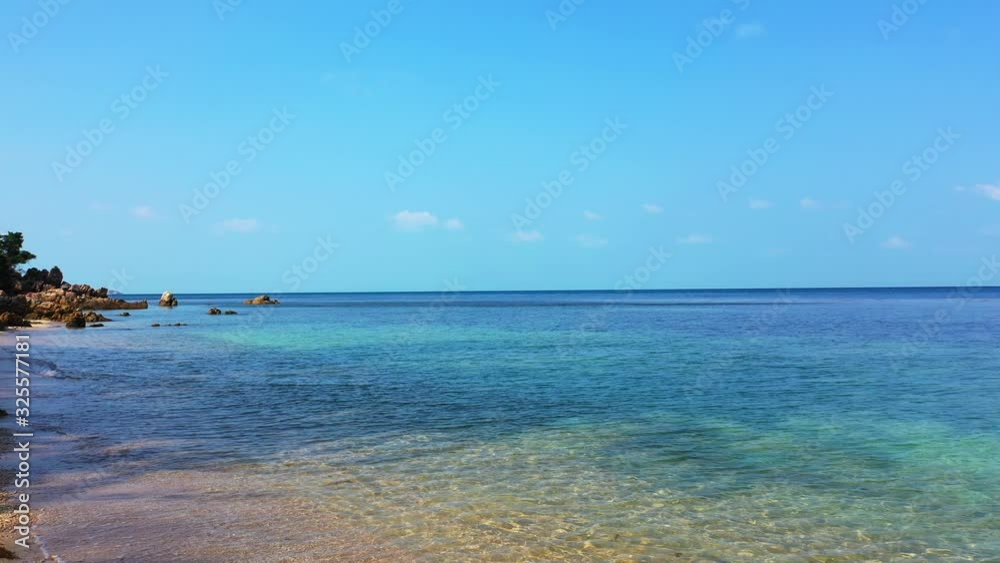 Tropical sandy beach and clear bright blue sky background. Peaceful seascape Tropical sandy beach and clear bright blue sky background. Peaceful seascape