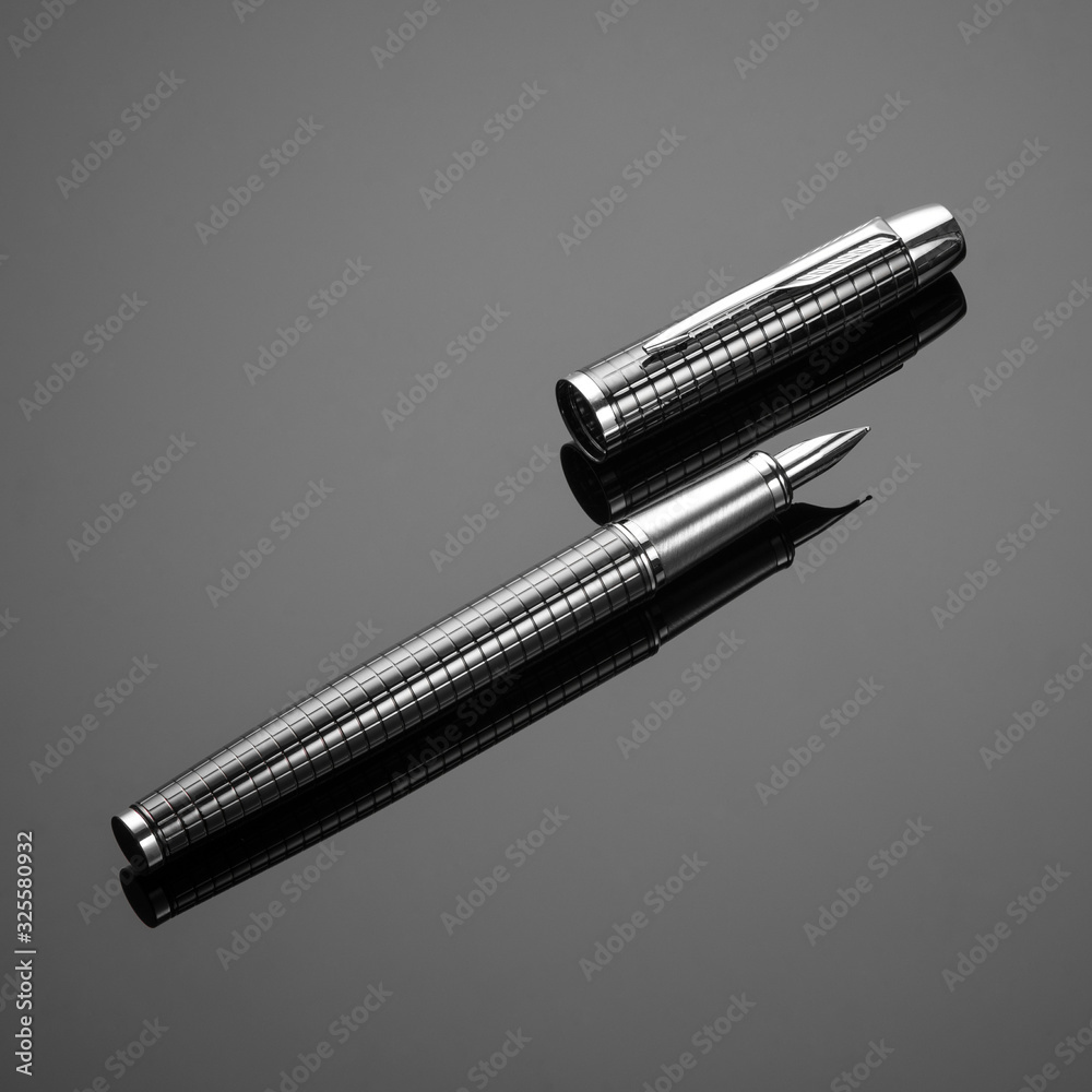 fashionable ink pen on a black background fashionable ink pen on a black background