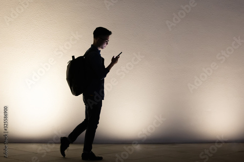silhouette of man use phone
