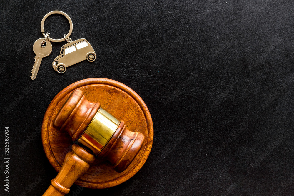 Car credit debt concept with judge gavel on black background top-down copy space