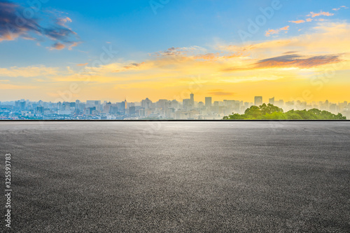 Empty race track and city skyline at sunrise in Hangzhou,China.