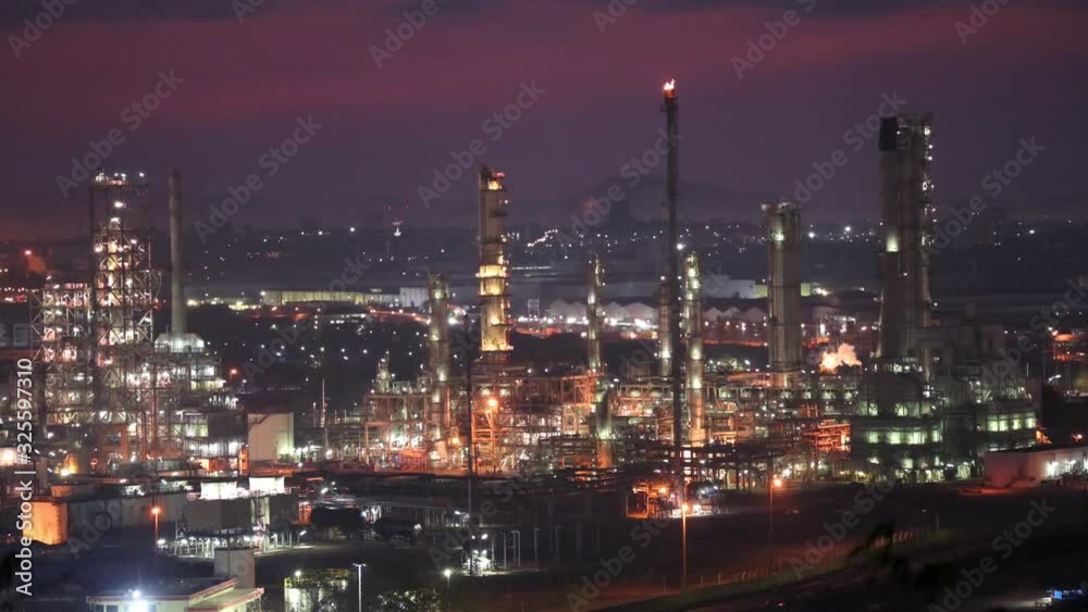 Oil refinery and traffic road before sunrise Oil refinery and traffic road before sunrise