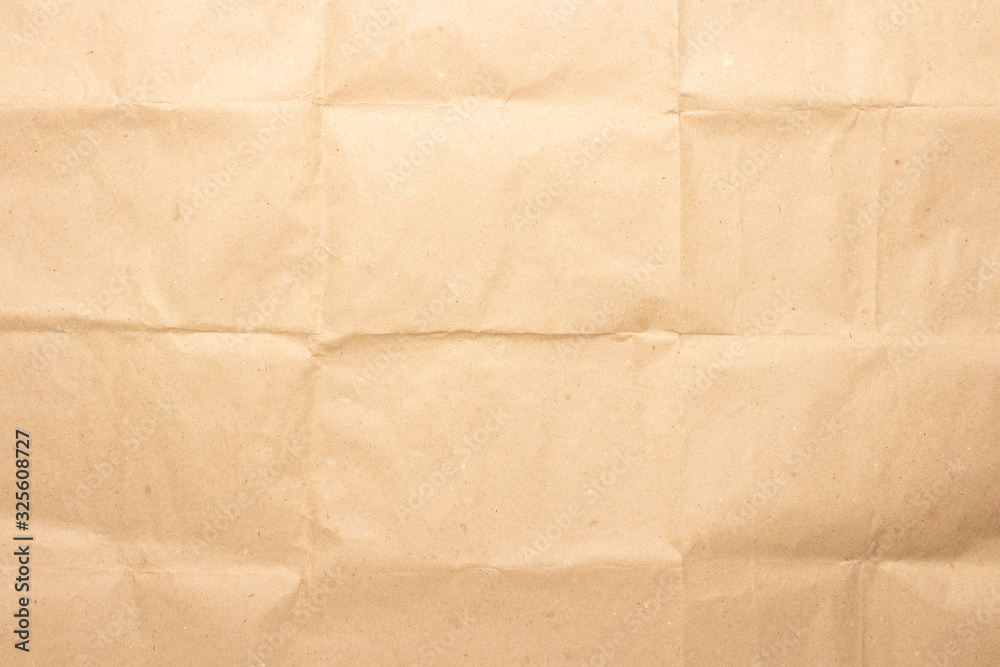 Crumpled brown craft paper. Texture, banner. Can be used as background. Top view, flat lay