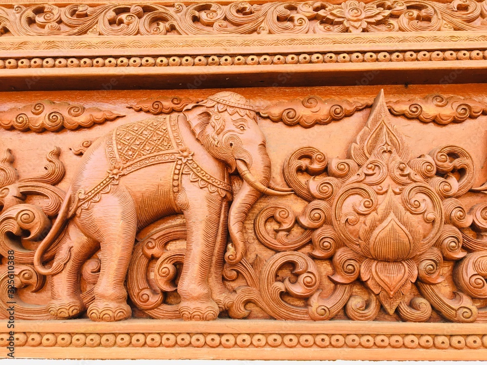 Obraz na plátně elephants Clay carving on the wall