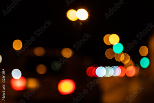 Blurred city lights of an intersection at night