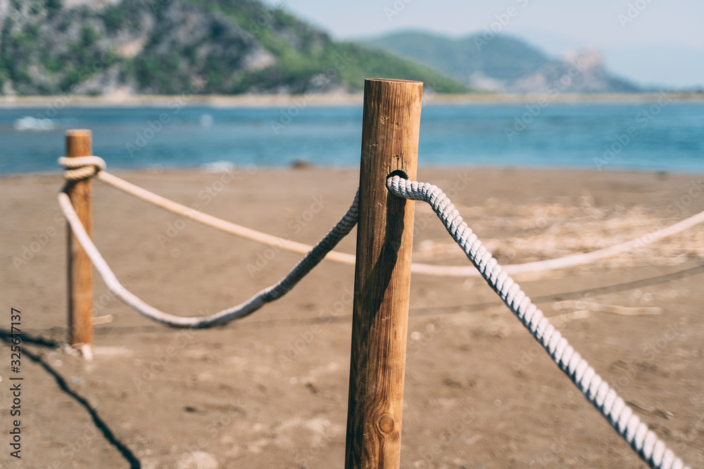 Obraz premium fence on the beach