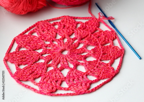 Needlework. Beautiful knitted pink napkin. Crochet. © Sagittarius_13