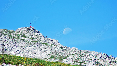 Alpine mountain peak Augstenberg over the Malbuntal alpine valley and in the Liechtenstein Alps mountain range - Malbun, Liechtenstein photo