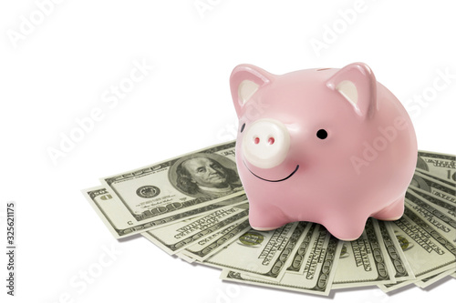 happy piggy bank on dollar bills isolated on white background