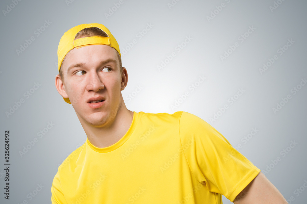 Distrustful redhead teenager looking at camera