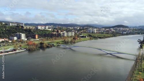 View of the Ponte Pedonal Pedro e Inês over the Mondego River, Coimbra, Portugal photo