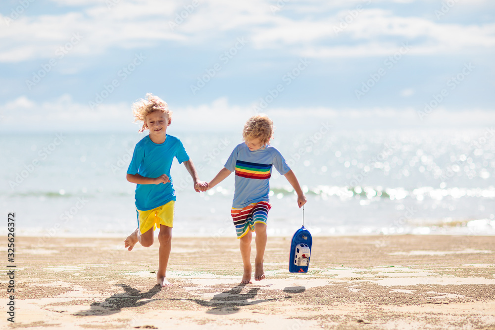 Kids playing on beach. Children play at sea. Kids playing on beach. Children play at sea.