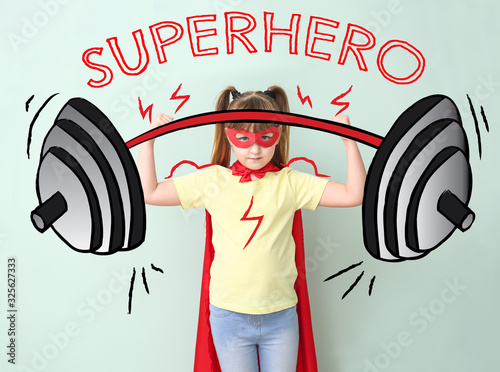 Little girl in superhero co...