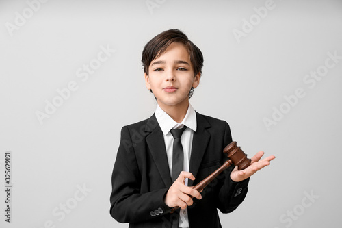 Little lawyer with judge ga...