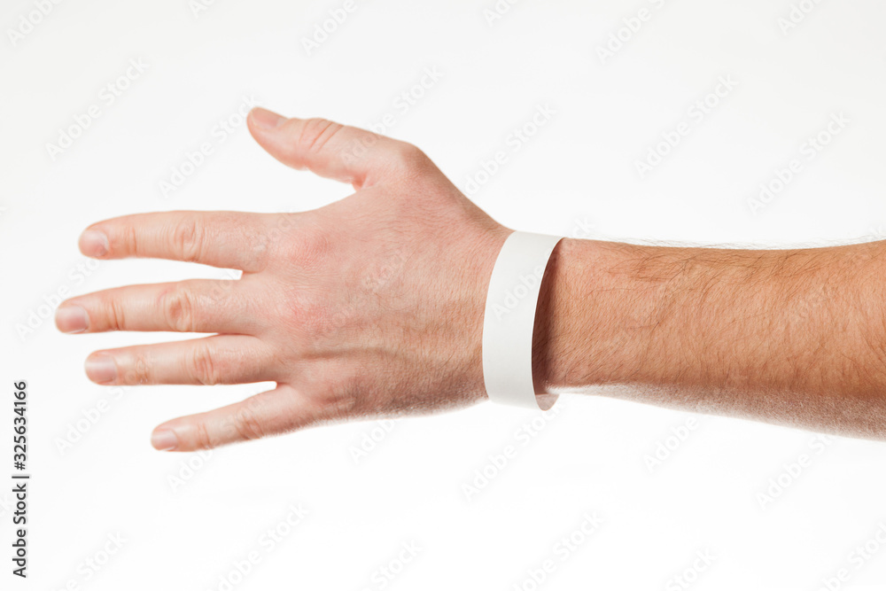 Hand with white wristband mockup. Empty ticket wrist band design.