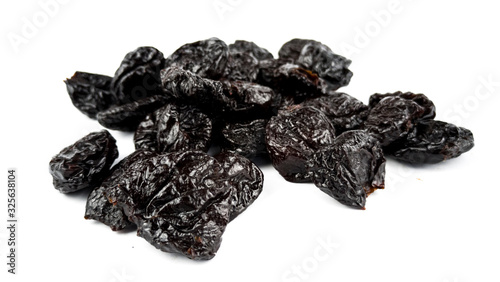 Dried plums on white background