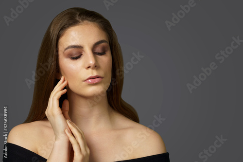 A girl with smokey eye and lip gloss makeup