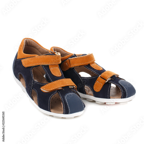 Baby black sandals for boys with orange inserts isolated on white