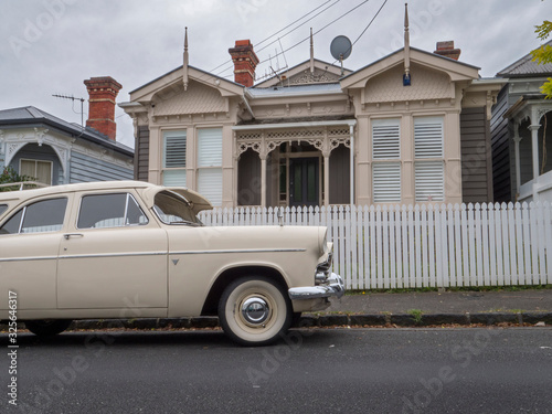 Ponsonby Auckland New Zealand. Oldtimer car in front of Victorian houses photo