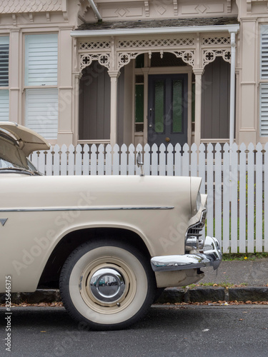 Ponsonby Auckland New Zealand. Oldtimer car in front of Victorian houses photo