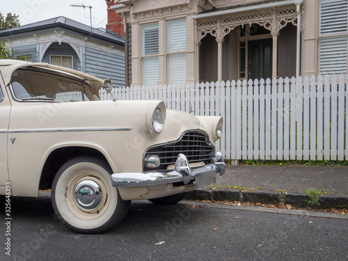 Ponsonby Auckland New Zealand. Oldtimer car in front of Victorian houses photo