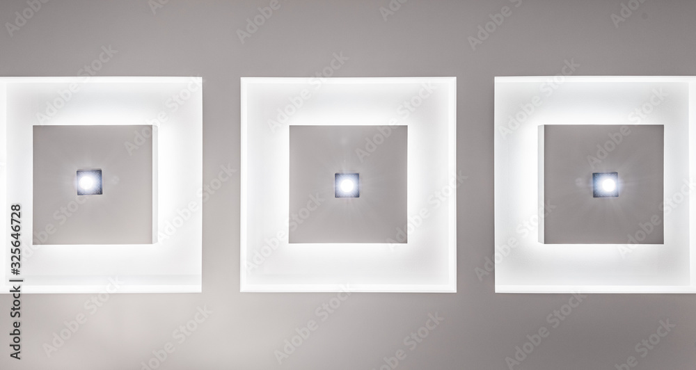 Part of the plasterboard ceiling decorated with ceiling lights and LED strip. Part of the plasterboard ceiling decorated with ceiling lights and LED strip.