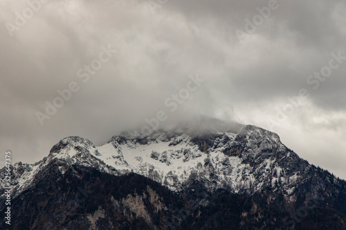misty mountain gorgeous landscape view winter time snow cover and cloudy sky dramatic background space © Артём Князь