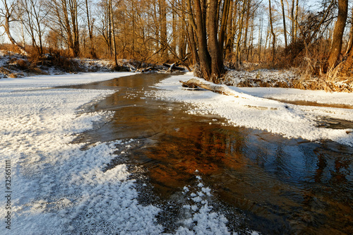 forest river in ice in early spring