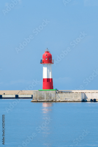 red-white lighthouse at sea